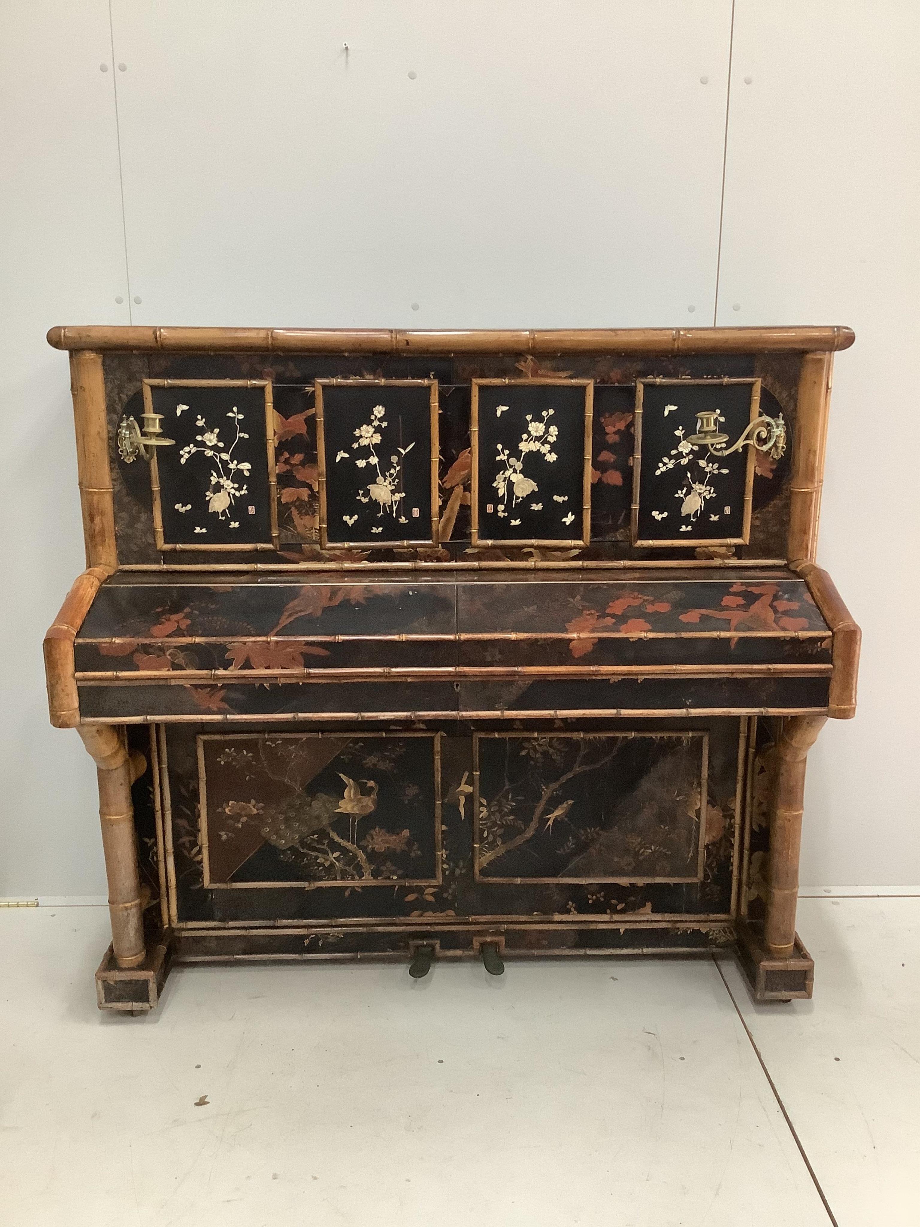 A late Victorian chinoiserie lacquer upright piano with bamboo effect decoration, width 142cm, height 129cm together with a matching stool. CITES Submission reference R2GP9JYE. Condition - fair
